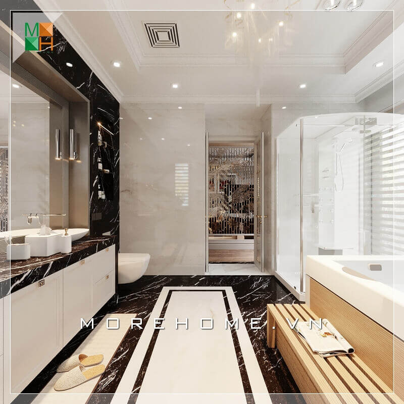 Sử dụng vách kính cường lực chắn giữa phòng tắm và vệ sinh đầy tinh tế và sáng tạo, kết hợp thêm bục kệ gỗ phòng tắm thông minh và tiện lợi. Thiết kế phòng tắm nhà phố
