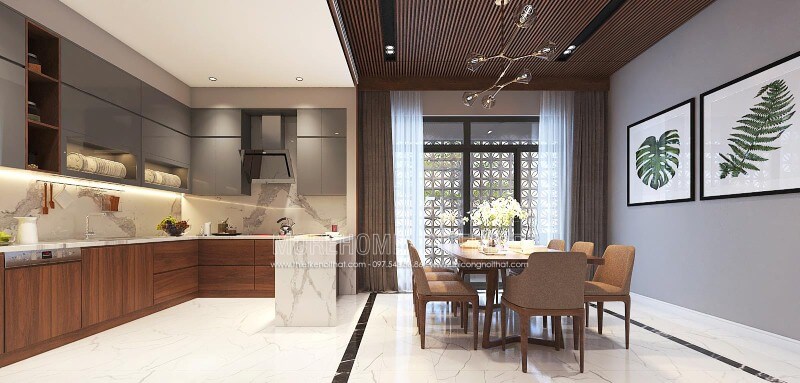 Sắp xếp nội thất phòng bếp liền phòng ăn sang trọng, độc đáo với nội thất gỗ chủ đạo từ tủ bếp, bộ bàn ghế, tường ốp gỗ tại biệt thự, nhà phố Vinh, Nghệ An. Mẫu nội thất biệt thự đẹp