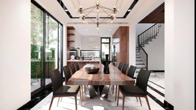 Trong bố trí không gian phòng ăn biệt thự theo xu hướng hiện đại, sự có mặt của đèn không chỉ để chiếu sáng mà còn có hiệu ứng thị giác kích thích sự vui thú mỗi khi các thành viên sum vầy. Trong đây kts Morehome đã sử dụng ý tưởng dùng đèn trang trí dạng lục giác với 6 đỉnh tựa như đóa hoa đang bung nở khoe sắc, và sẽ đẹp hơn nếu thể hiện đúng thời điểm, và hiển nhiên trong mỗi tổ ấm ngày nay, trong 1 ngày làm việc bận rộn thì bữa tối lại là bữa chính và quan trọng nhất để nghệ thuật ánh sáng được phát huy tác dụng của mình.